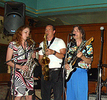 Aaron MacDonald and Margarita onstage with the Charlie Morris Band at Montreux