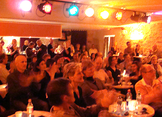 A fuzzy orange crowd at the Bar de la Ferme in Nyon. Photo by Steve Polo.